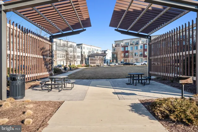 a view of a park with bench and trees