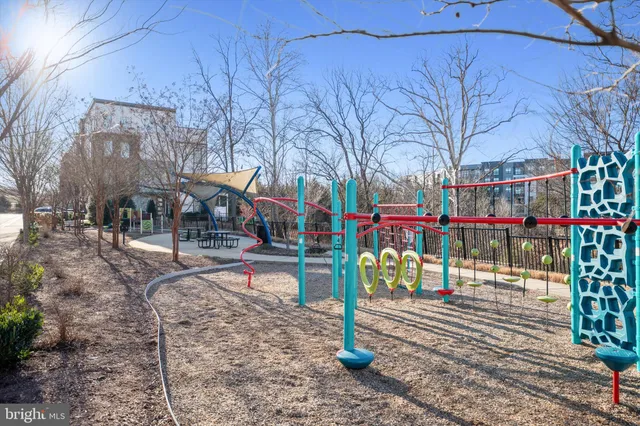 a view of river covered by trees and buildings