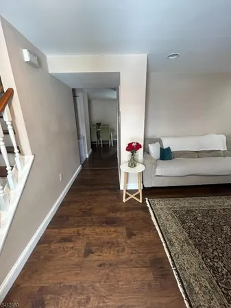 a living room with furniture and a rug