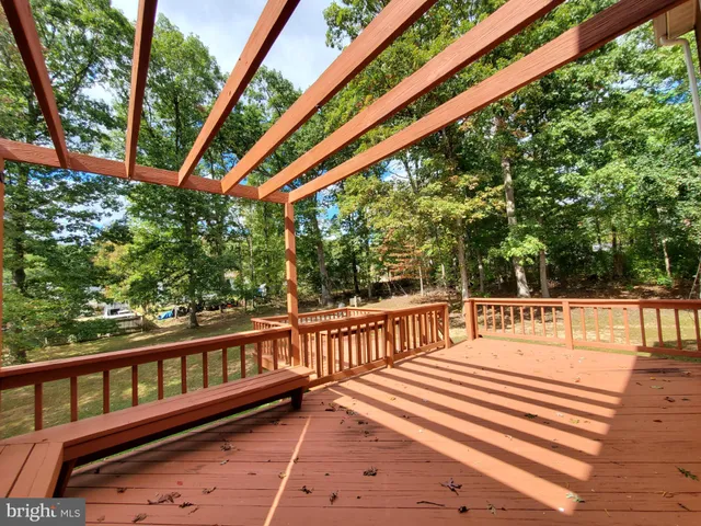 a view of a two chairs and table in the balcony