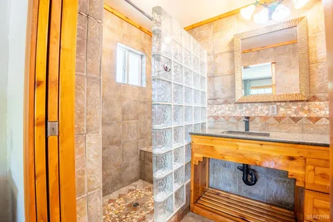 a bathroom with a tub and shower