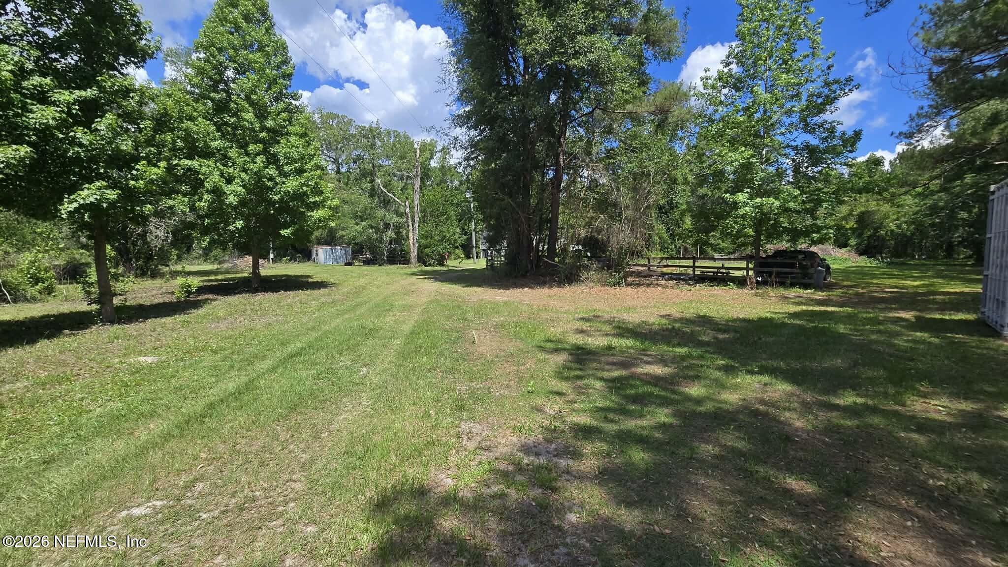3923 Skipper Road Middleburg, FL 32068 - Photo 2 of 25 a view of a field with trees in the background