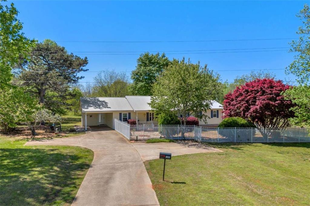 185 Skelton Road Hoschton, GA 30548 - Photo 1 of 1 a view of a swimming pool with a patio