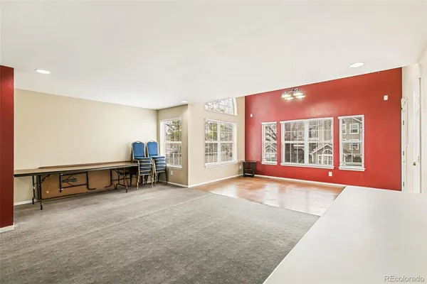 a view of a livingroom with furniture and windows