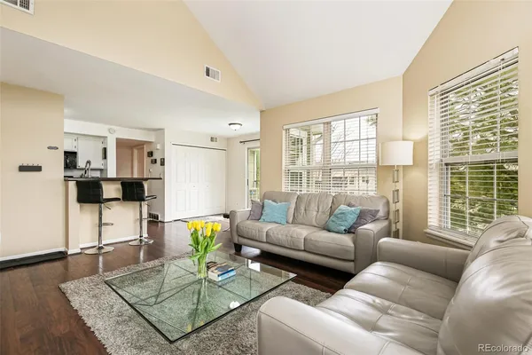a living room with furniture and a table