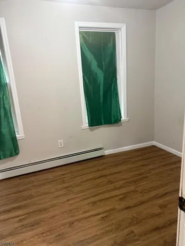 a view of a small space with wooden floor