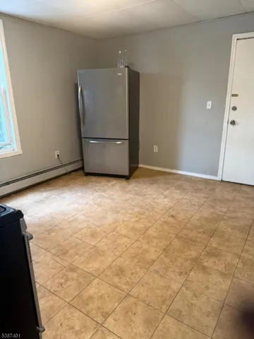 a view of a refrigerator in a kitchen