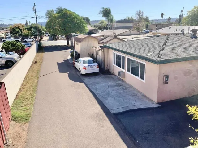 an aerial view of a house with outdoor space