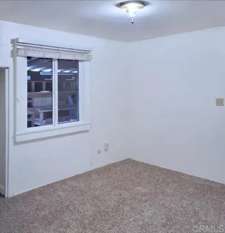 a view of a chandelier in an empty room