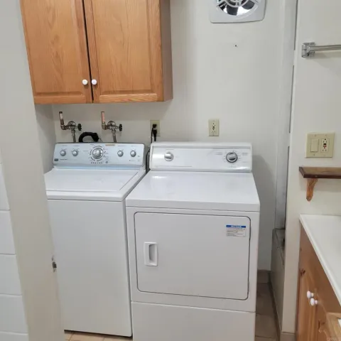 a white toilet sitting next to a bathroom sink