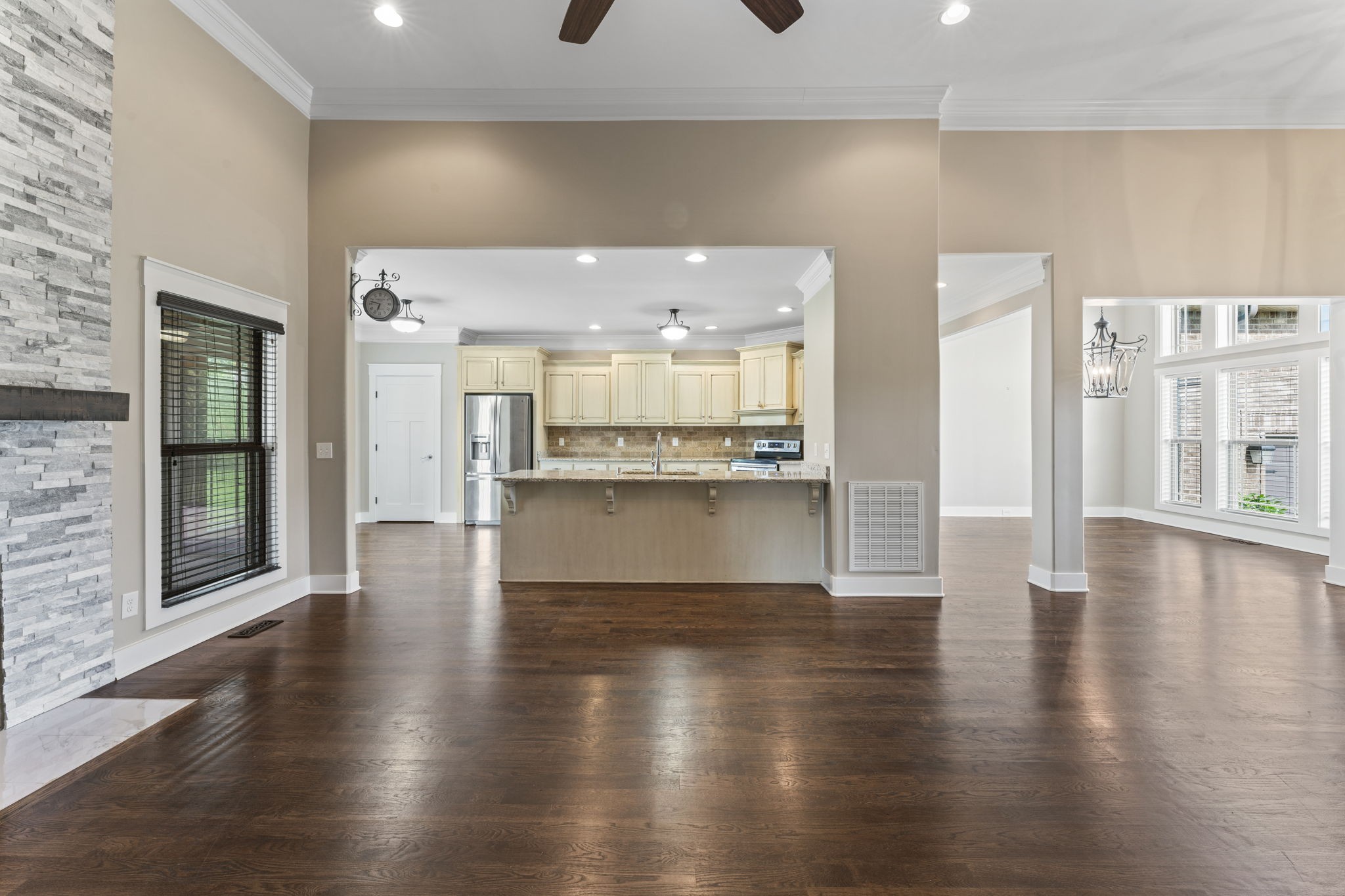 523 Urlacher Drive Murfreesboro, TN 37129 - Photo 12 of 45 a view of a hallway with wooden floor and a kitchen
