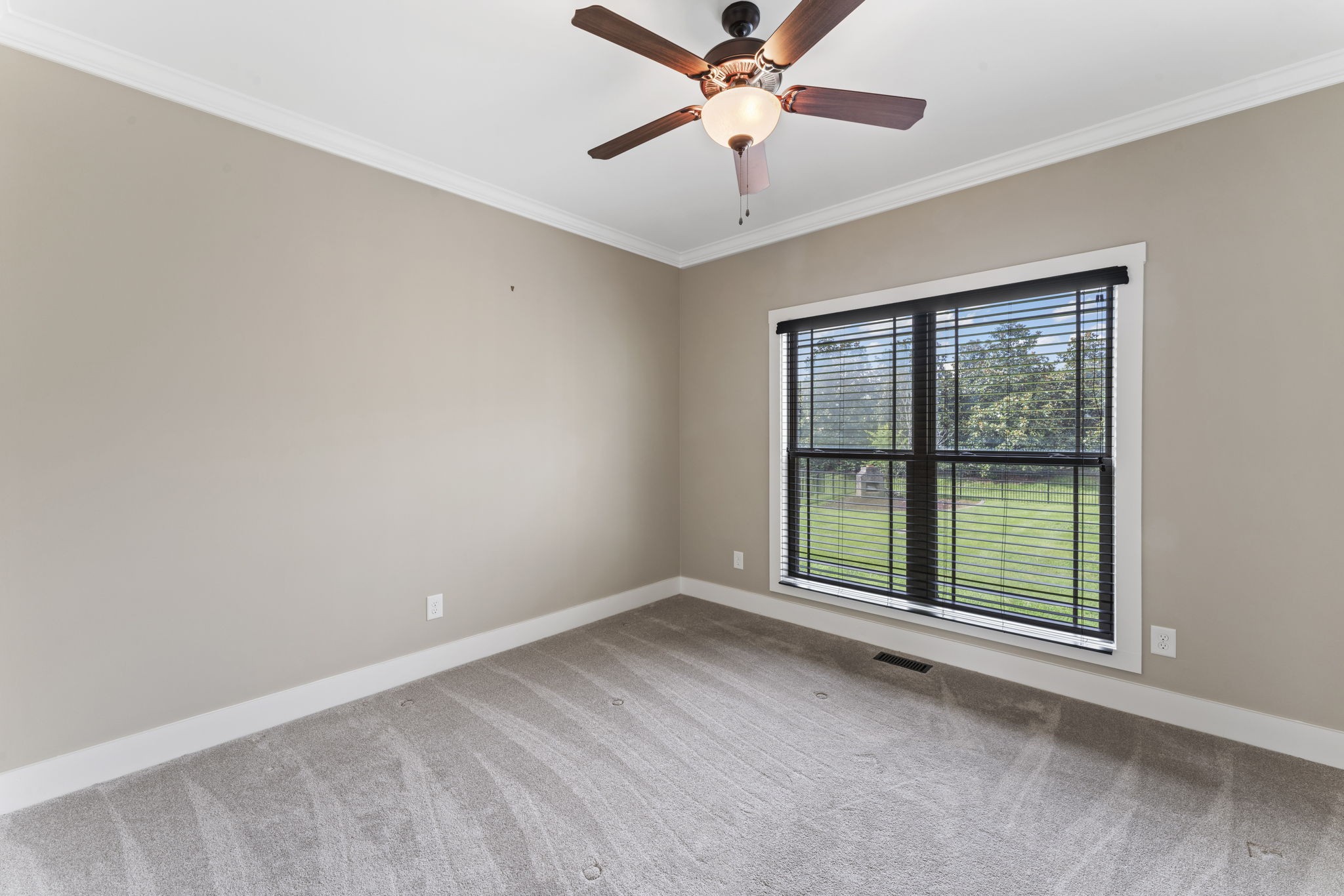 523 Urlacher Drive Murfreesboro, TN 37129 - Photo 16 of 45 an empty room with chandelier fan and windows
