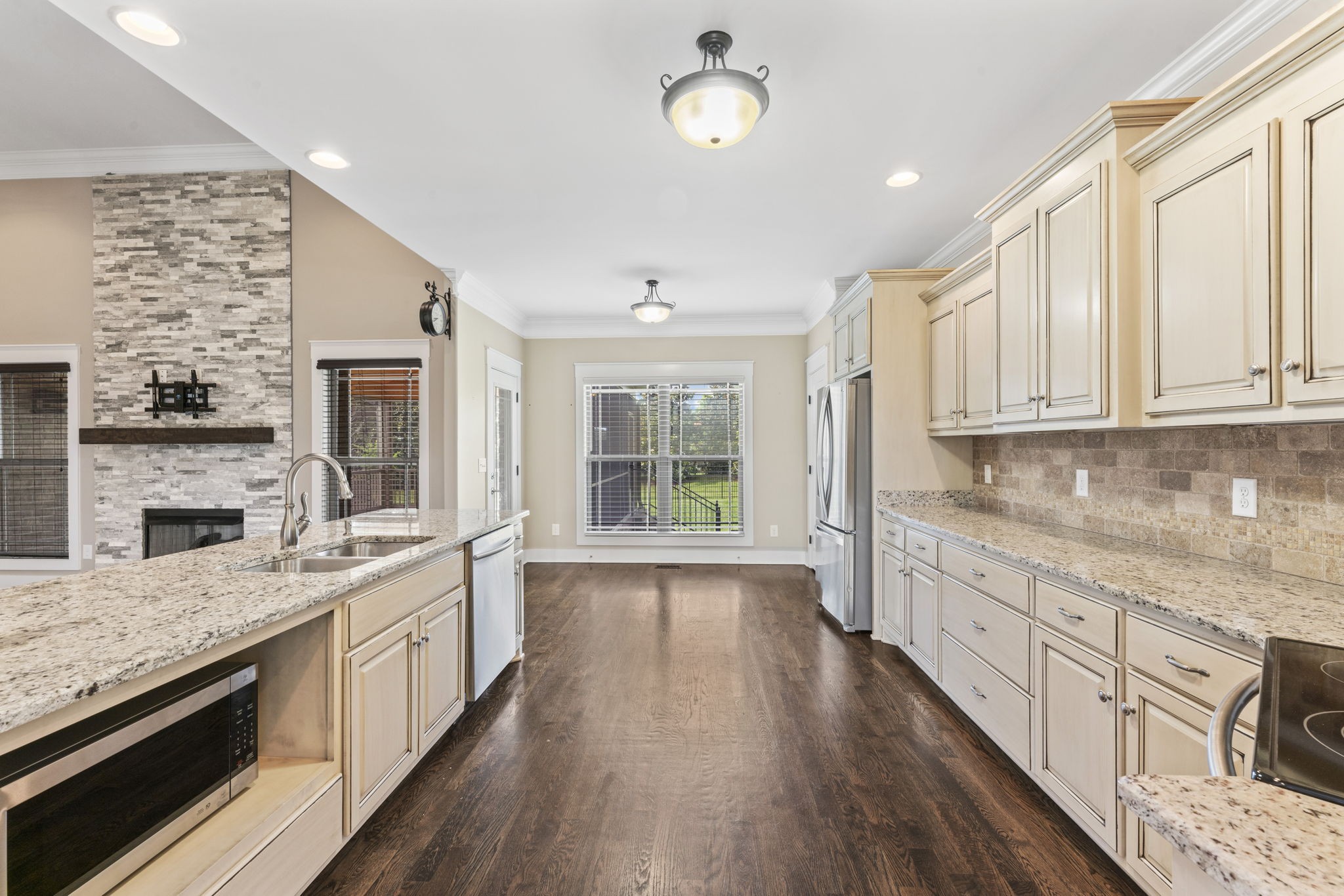523 Urlacher Drive Murfreesboro, TN 37129 - Photo 6 of 45 a large kitchen with granite countertop a large window and stainless steel appliances