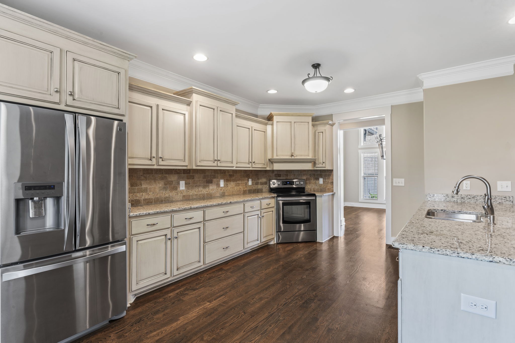 523 Urlacher Drive Murfreesboro, TN 37129 - Photo 8 of 45 a kitchen with granite countertop a refrigerator stove top oven and sink