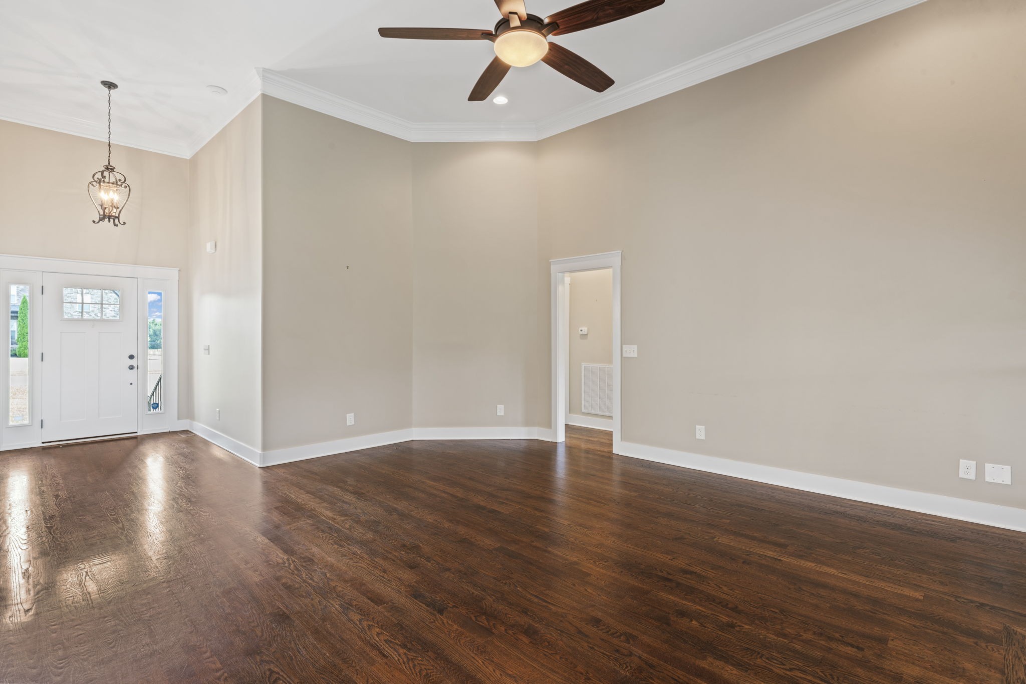 523 Urlacher Drive Murfreesboro, TN 37129 - Photo 9 of 45 a view of an empty room with wooden floor and a ceiling fan