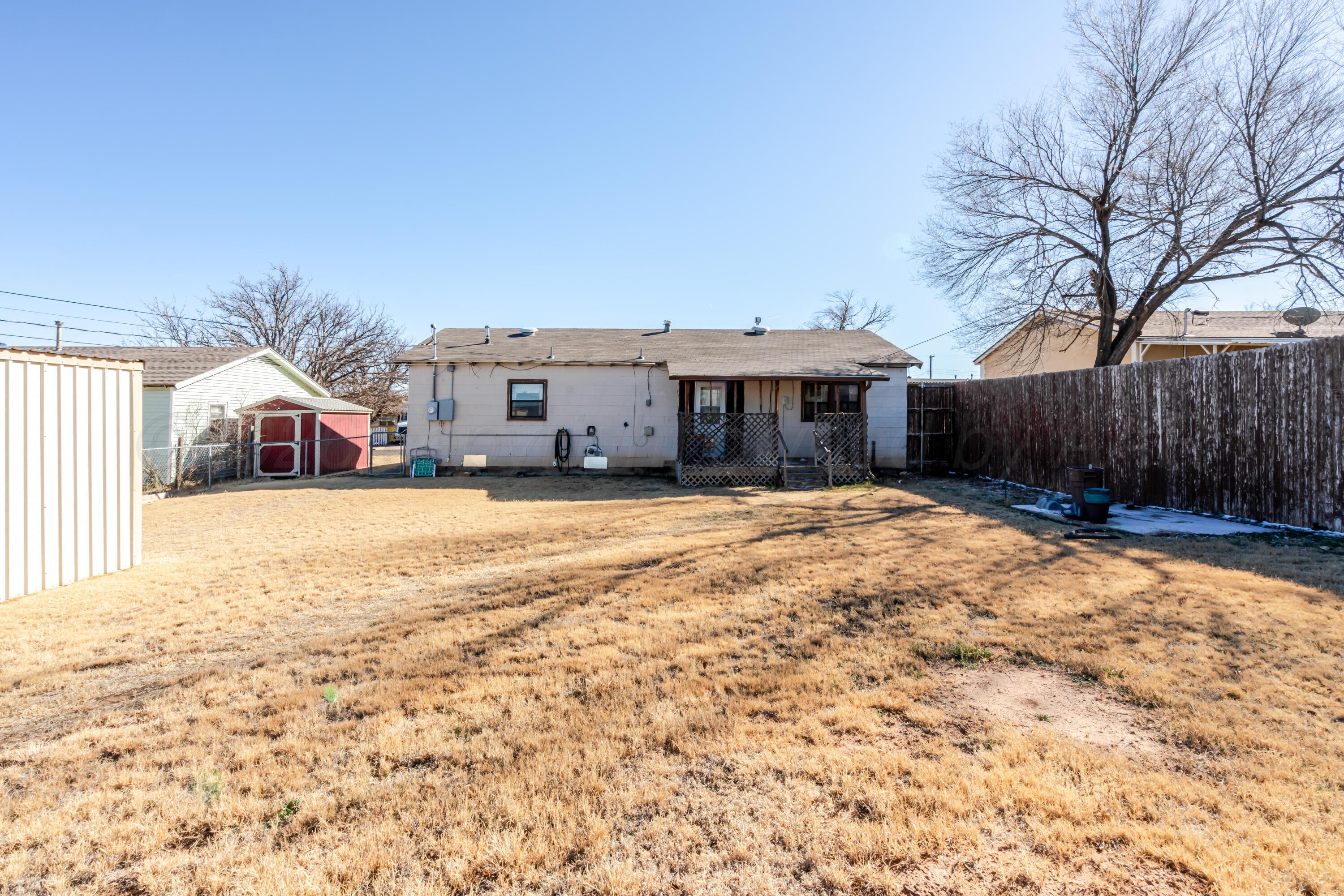2805 Palm Street Amarillo, TX 79107 - Photo 16 of 17 a front view of a house with a yard covered in snow