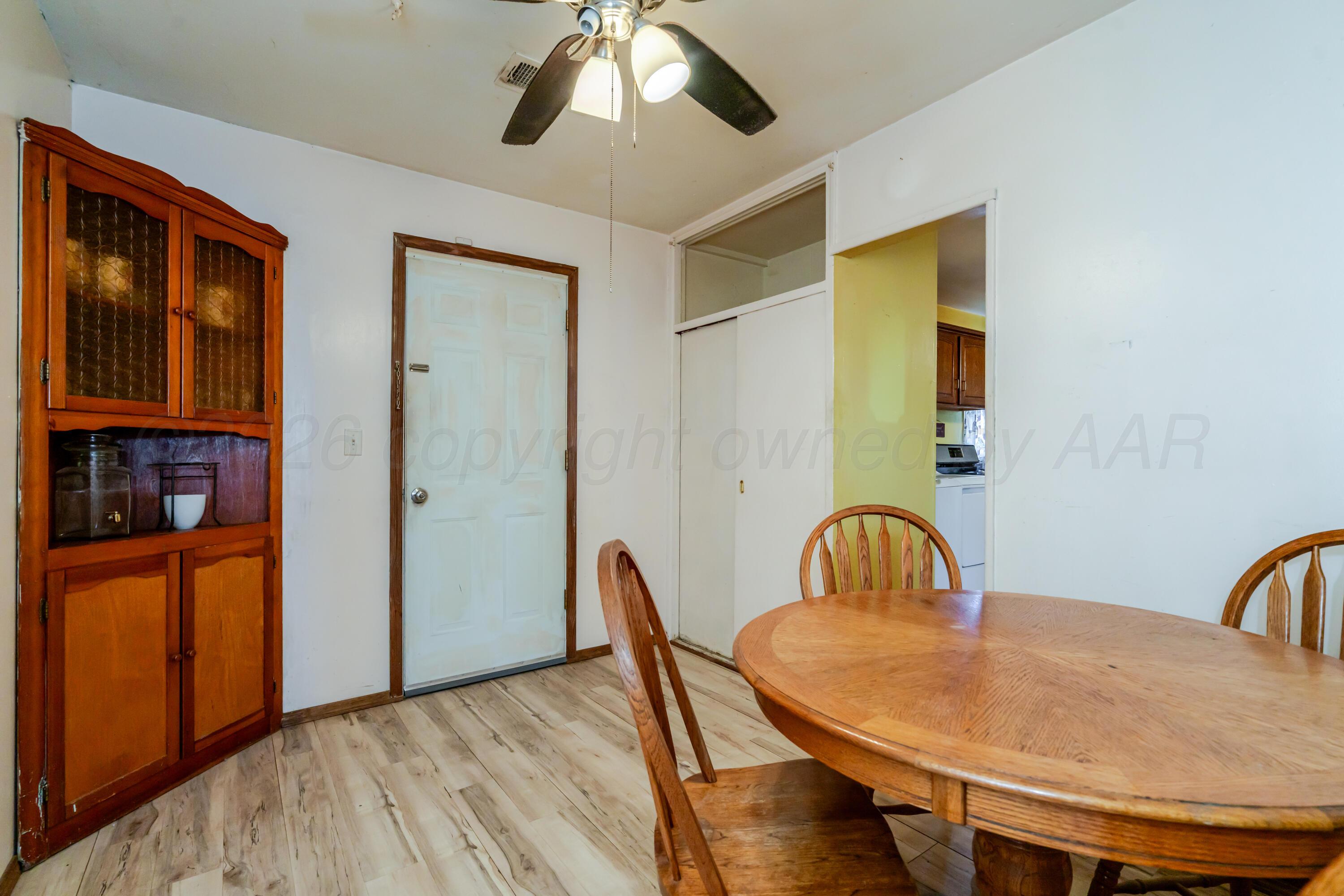 2805 Palm Street Amarillo, TX 79107 - Photo 10 of 17 a view of a dining room with furniture and wooden floor