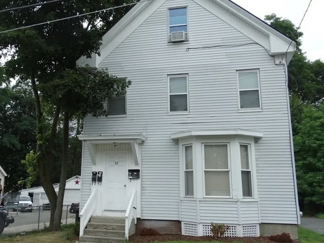 a front view of a house with garage