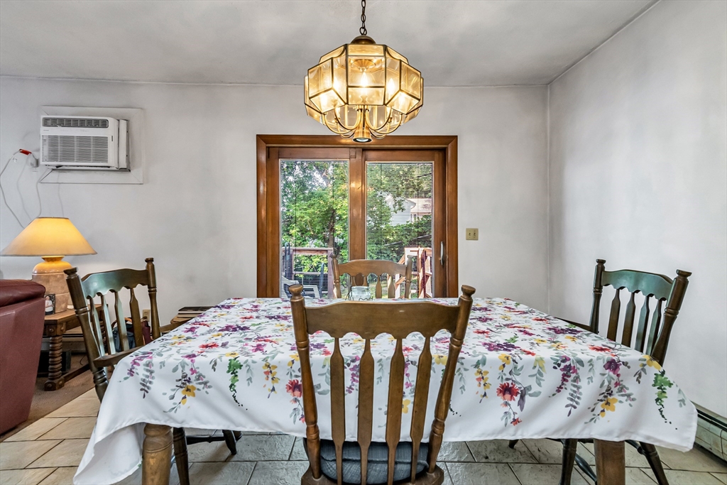 136 Vane Street Revere, MA 02151 - Photo 12 of 30 a view of a dining room with furniture and a chandelier