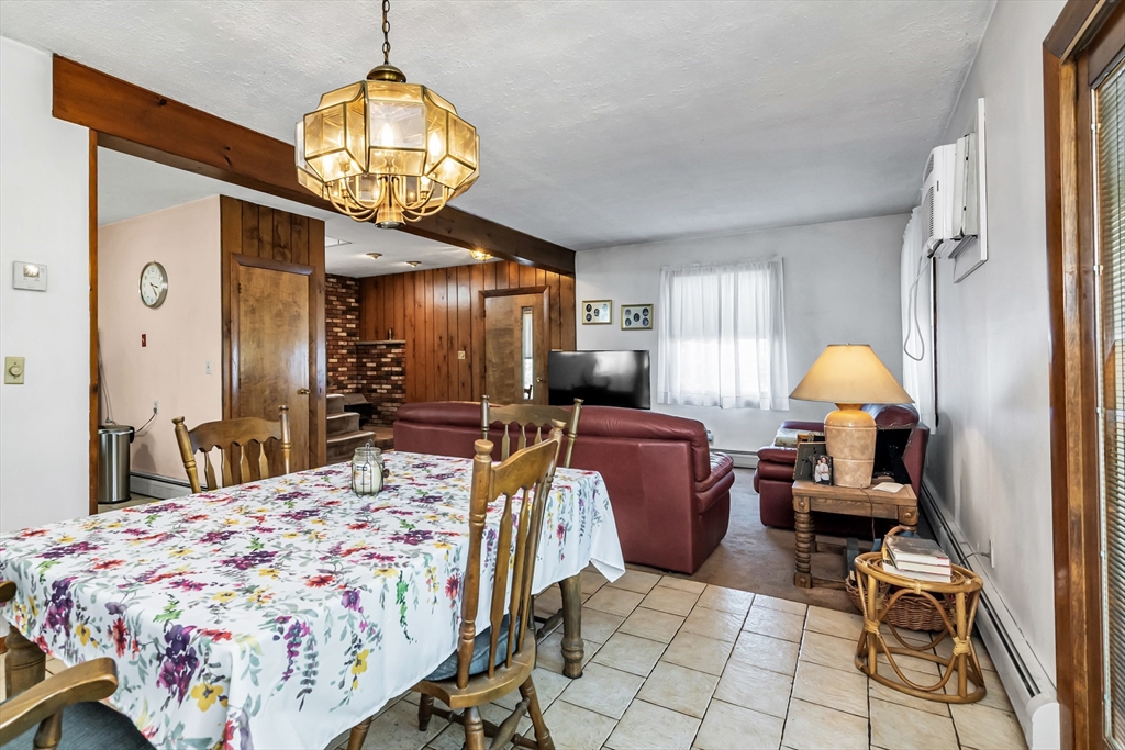 136 Vane Street Revere, MA 02151 - Photo 13 of 30 a bedroom with a bed and a chandelier
