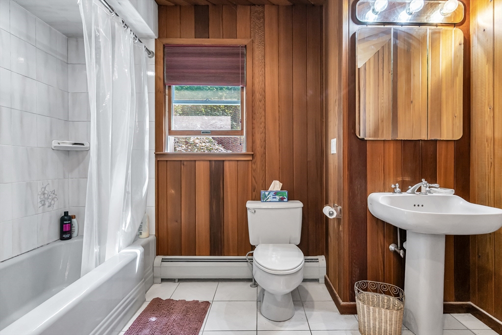 136 Vane Street Revere, MA 02151 - Photo 15 of 30 a bathroom with a sink a toilet and shower curtain