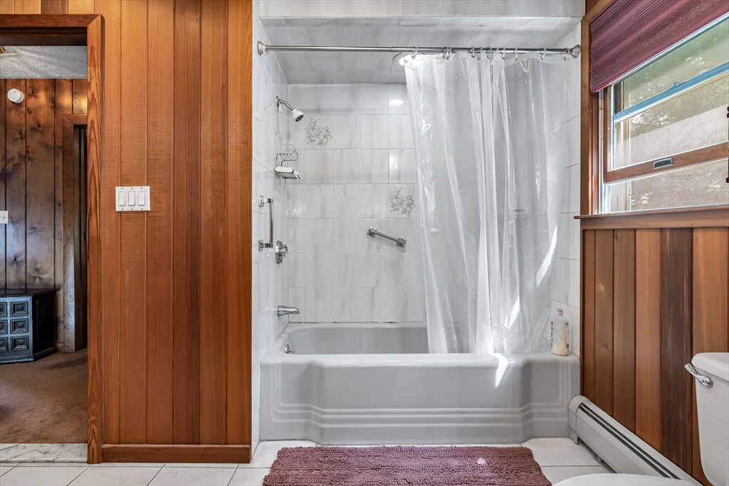 136 Vane Street Revere, MA 02151 - Photo 16 of 30 a bathroom with a shower curtain and a window