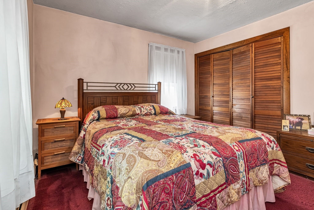 136 Vane Street Revere, MA 02151 - Photo 18 of 30 a bedroom with a bed and a window