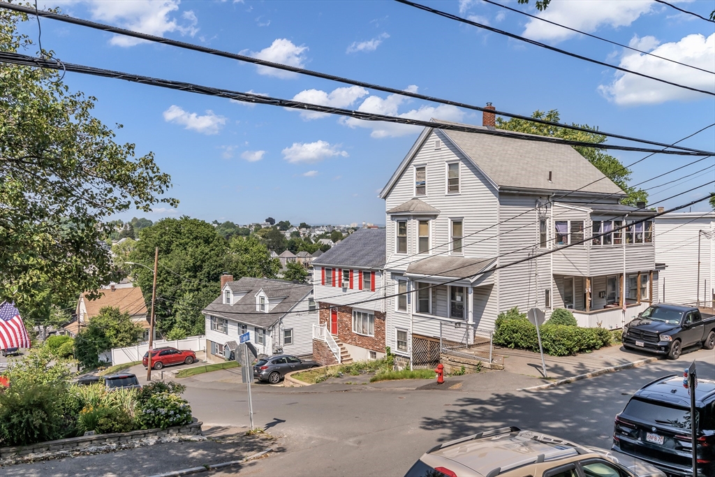 136 Vane Street Revere, MA 02151 - Photo 25 of 30 a front view of a building with sitting area