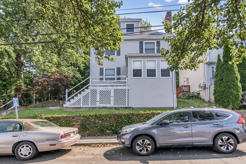 136 Vane Street Revere, MA 02151 - Photo 28 of 30 a car parked in front of a house