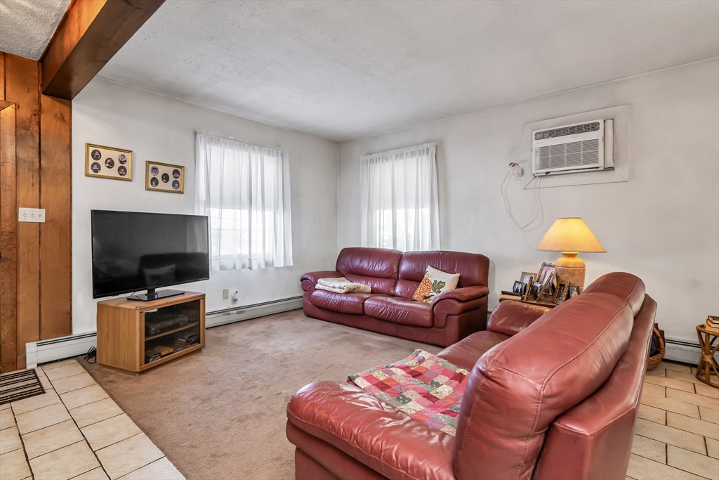 136 Vane Street Revere, MA 02151 - Photo 5 of 30 a living room with furniture and a flat screen tv