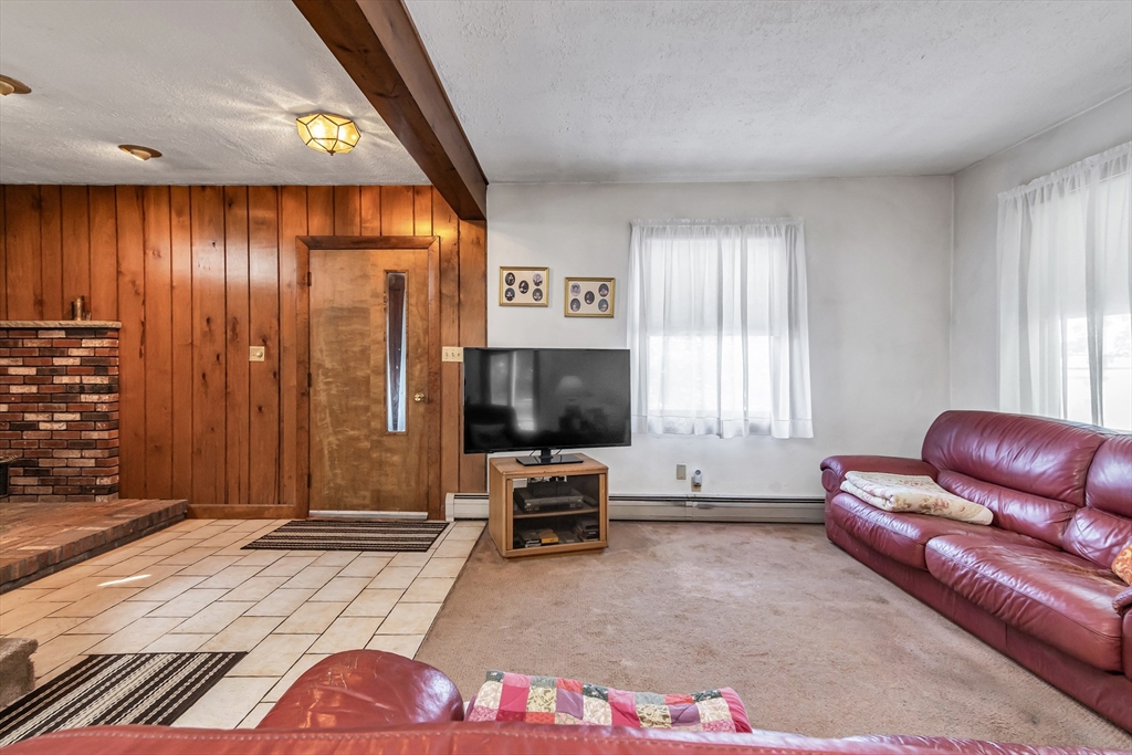 136 Vane Street Revere, MA 02151 - Photo 6 of 30 a living room with furniture and a flat screen tv