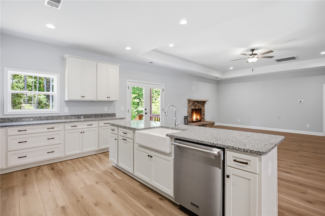 912 Watercrest Road West Union, SC 29696 - Photo 11 of 49 Bright, open concept kitchen seamlessly connects to the living area, offering both style and functionality.