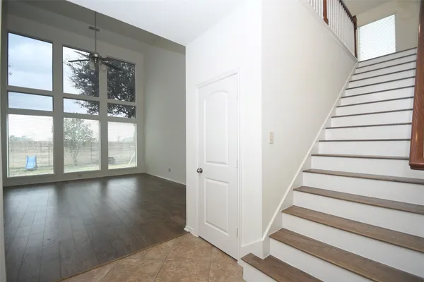 a view of an entryway with wooden floor