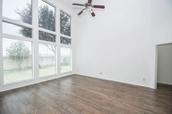 a view of an empty room with a window
