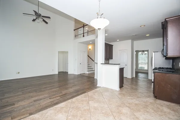 a view of a kitchen with microwave and cabinets