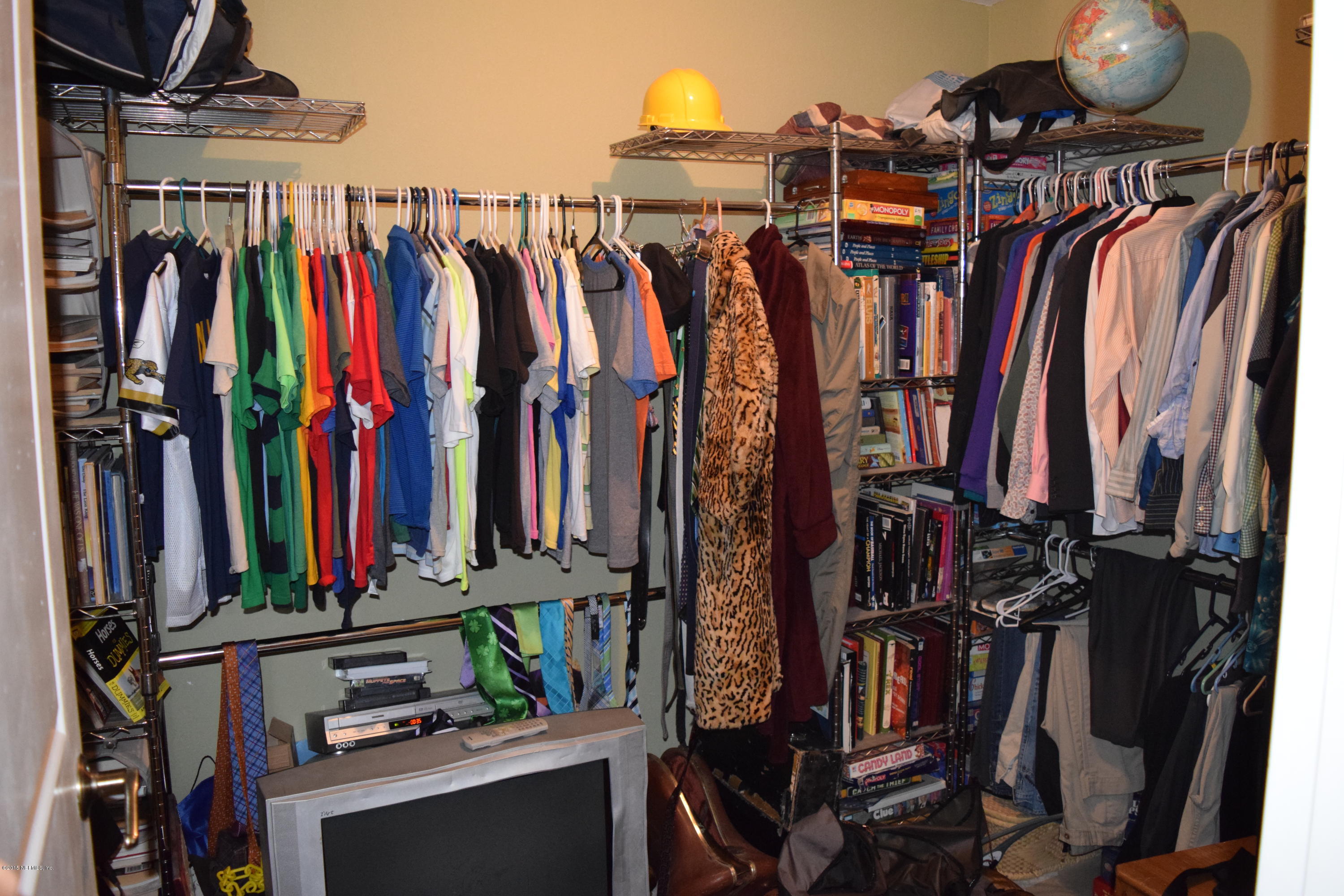 45116 Bismark Road Callahan, FL 32011 - Photo 40 of 72 a view of walk in closet with clothes