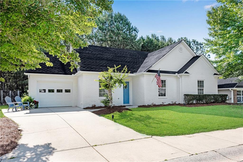 125 Pine Ridge Trace Athens, GA 30605 - Photo 1 of 28 a front view of a house with a yard and garage