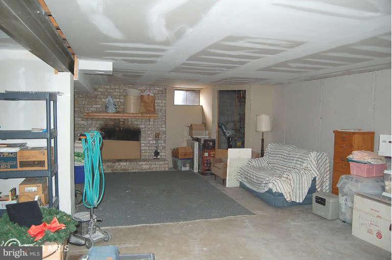 910 Trevanion Road Union Bridge, MD 21791 - Photo 21 of 30 Brick Fireplace in Partially finished lower level