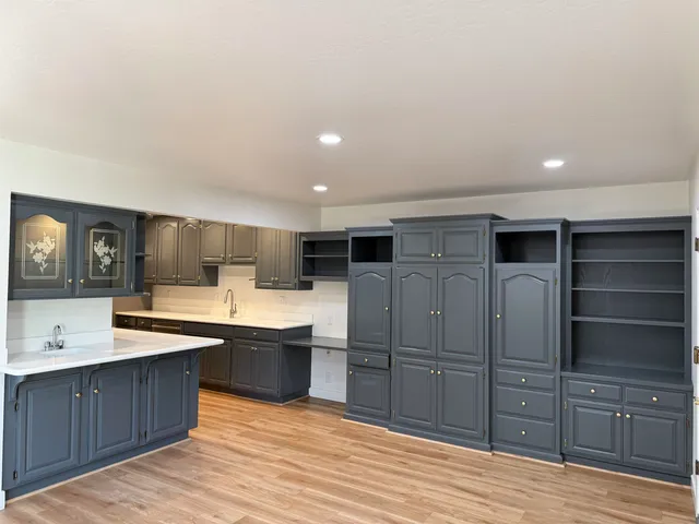 a utility room with sink dryer and washer