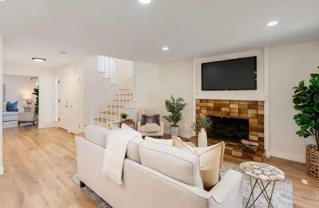 a spacious bedroom with a bed and a couch