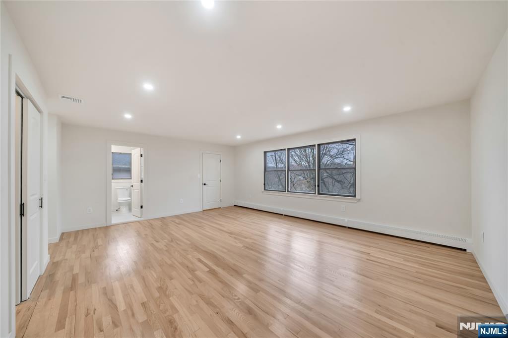 468 Morse Avenue Ridgefield, NJ 07657 - Photo 26 of 48 a view of an empty room with wooden floor and a window