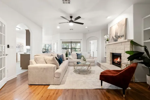 a living room with furniture fireplace and window