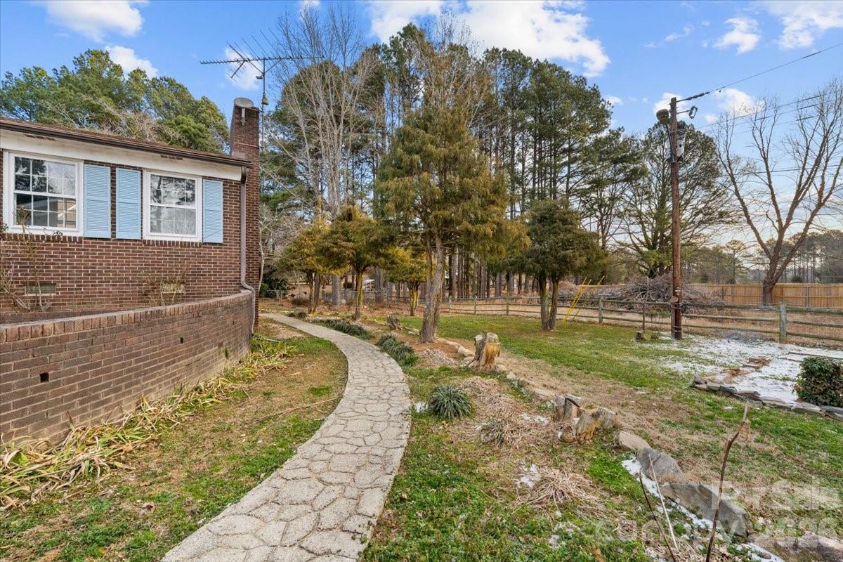 444 Craven Street Star, NC 27356 - Photo 11 of 48 a view of a yard with plants and trees
