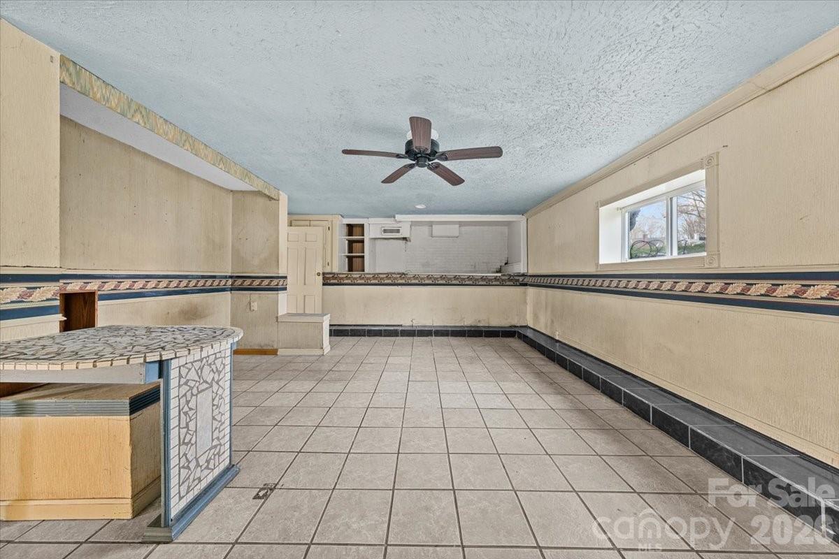 444 Craven Street Star, NC 27356 - Photo 16 of 48 a kitchen with granite countertop a sink cabinets and stainless steel appliances