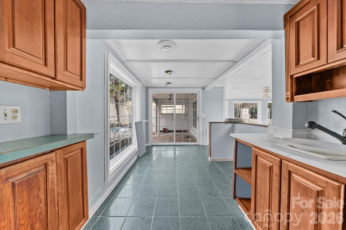 444 Craven Street Star, NC 27356 - Photo 32 of 48 a kitchen with stainless steel appliances granite countertop a refrigerator and wooden cabinets