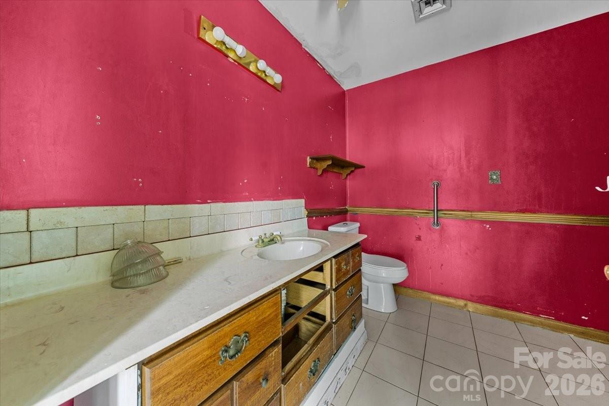 444 Craven Street Star, NC 27356 - Photo 36 of 48 a bathroom with a sink and a mirror