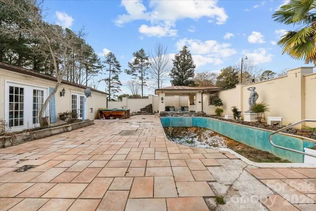 a view of a yard with cars