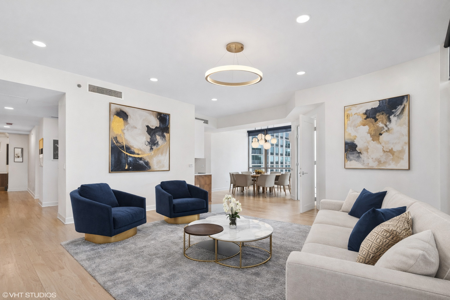 21 East Huron Street, Unit 1806 Chicago, IL 60611 - Photo 3 of 43 a living room with furniture and a wooden floor