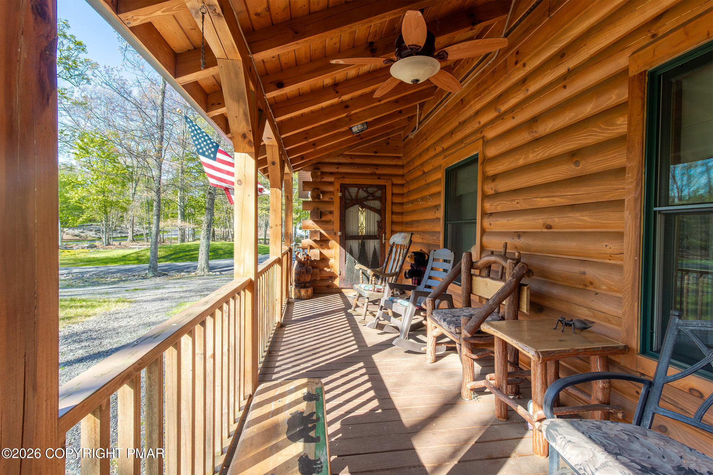 1160 Bluebird Lane Bushkill, PA 18324 - Photo 37 of 44 a view of a patio with table and chairs and wooden floor