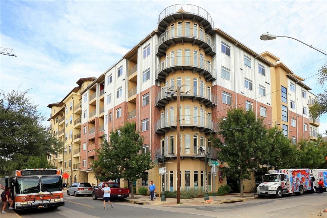 910 West 25th Street, Unit 502 Austin, TX 78705 - Photo 3 of 26 a front view of a building with lot of cars and trees